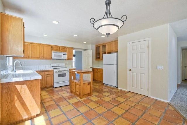2053 Sequoia St, San Marcos, CA 92078 - kitchen featuring white appliances, tile counters, recessed lighting, decorative light fixtures, and a center island