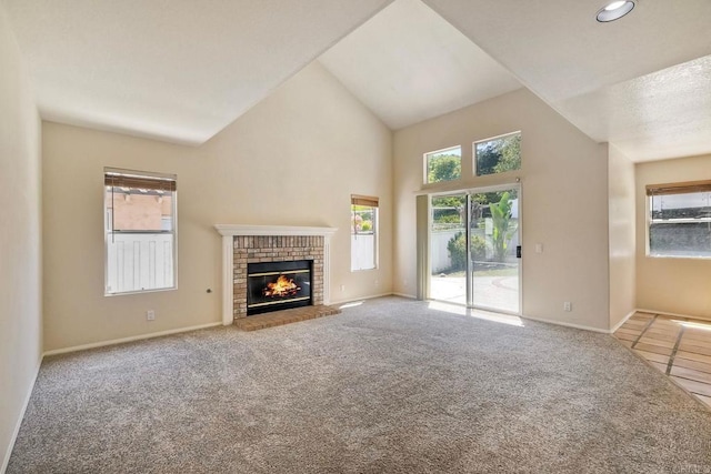 2053 Sequoia St, San Marcos, CA 92078 - unfurnished living room featuring carpet, plenty of natural light, a fireplace, recessed lighting, and high vaulted ceiling