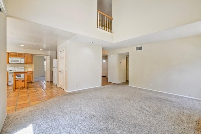 2053 Sequoia St, San Marcos, CA 92078 - unfurnished living room with light carpet, recessed lighting, and light tile patterned floors
