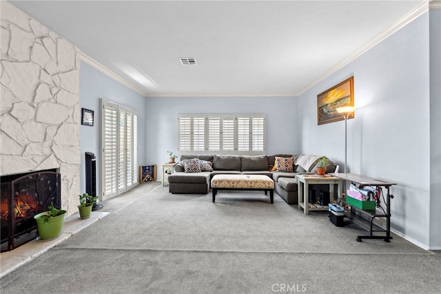 42821 15th St W Unit 4, Lancaster, CA 93534 - carpeted living room featuring ornamental molding and a fireplace