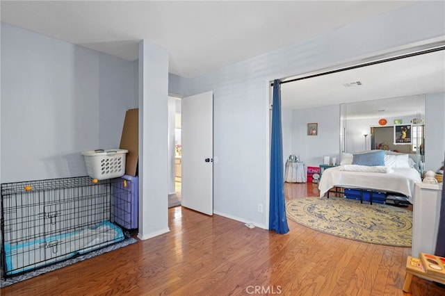 42821 15th St W Unit 4, Lancaster, CA 93534 - bedroom with wood finished floors and baseboards