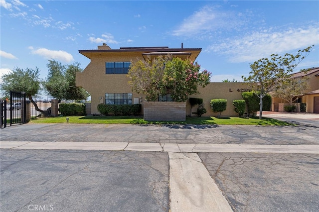 42821 15th St W Unit 4, Lancaster, CA 93534 - view of front of house featuring stucco siding