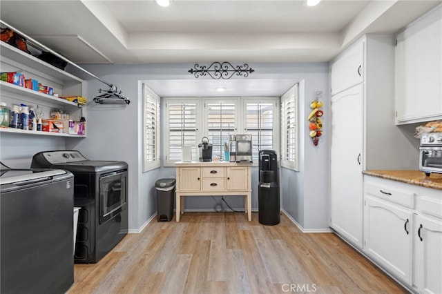 42821 15th St W Unit 4, Lancaster, CA 93534 - washroom with independent washer and dryer, light wood-type flooring, and recessed lighting