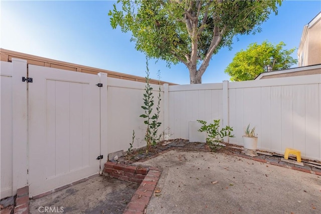 3 Albany Unit 61, Irvine, CA 92604 - fenced backyard with a patio area and a gate