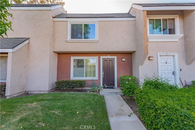 3 Albany Unit 61, Irvine, CA 92604 - view of front of house featuring stucco siding and a front yard