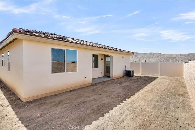 7408 Desert Sky Dr, Yucca Valley, CA 92284 - back of house featuring stucco siding, a tile roof, a patio, and a mountain view