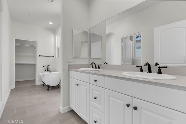 7408 Desert Sky Dr, Yucca Valley, CA 92284 - bathroom featuring double vanity, a soaking tub, recessed lighting, and plenty of natural light