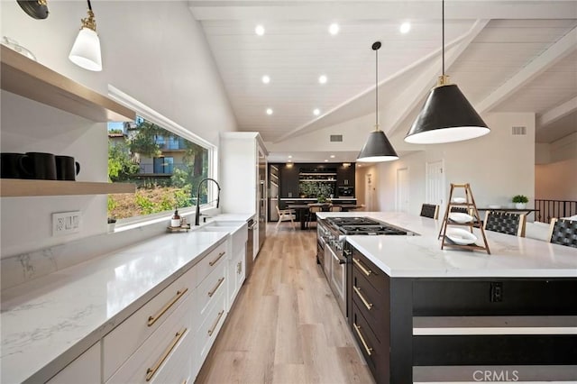 3532 Mesquite Dr, Calabasas, CA 91302 - kitchen featuring white cabinetry, light wood-style floors, open shelves, beamed ceiling, and a large island
