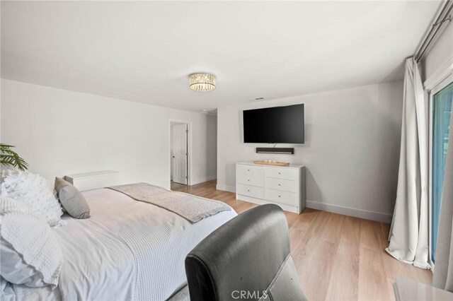 3532 Mesquite Dr, Calabasas, CA 91302 - bedroom with light wood-type flooring and baseboards