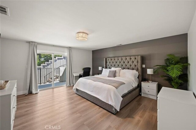 3532 Mesquite Dr, Calabasas, CA 91302 - bedroom featuring access to exterior and light wood-style flooring