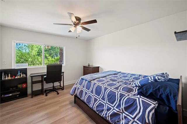 3532 Mesquite Dr, Calabasas, CA 91302 - bedroom with wood finished floors, a desk, and a ceiling fan