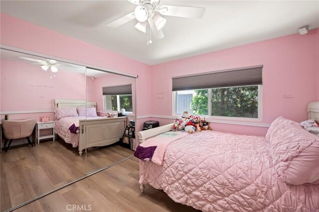 3532 Mesquite Dr, Calabasas, CA 91302 - bedroom with light wood-style floors, ceiling fan, and a closet