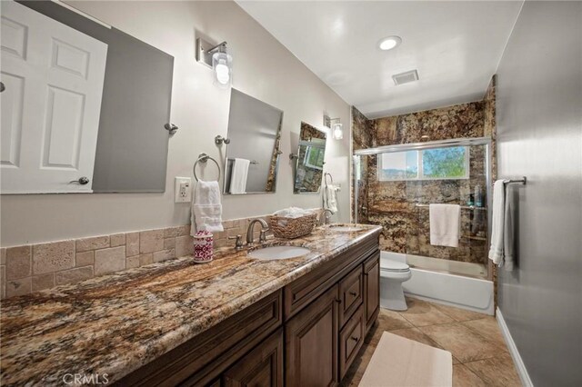 3532 Mesquite Dr, Calabasas, CA 91302 - bathroom featuring double vanity, shower / bath combination with glass door, and tile patterned flooring