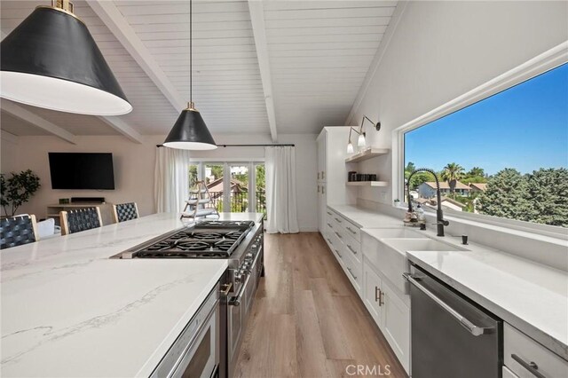 3532 Mesquite Dr, Calabasas, CA 91302 - kitchen featuring stainless steel appliances, light wood finished floors, beam ceiling, open shelves, and hanging light fixtures