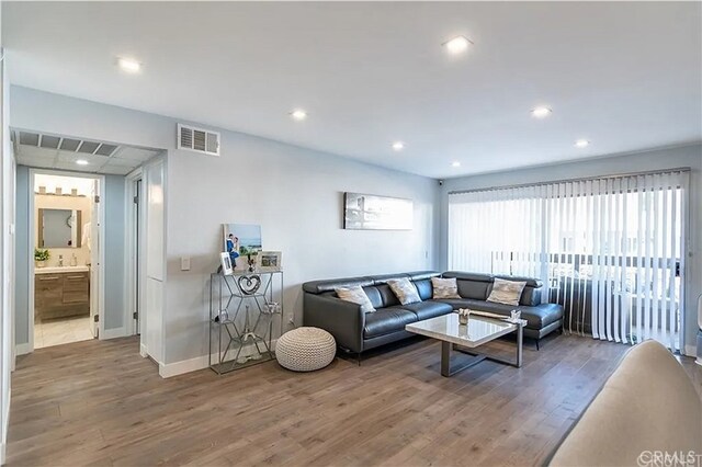 1236 N Columbus Ave Unit 28, Glendale, CA 91202 - living room with wood finished floors and recessed lighting