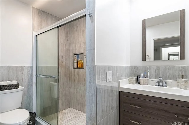 1236 N Columbus Ave Unit 28, Glendale, CA 91202 - bathroom featuring tile walls, vanity, a stall shower, and a wainscoted wall
