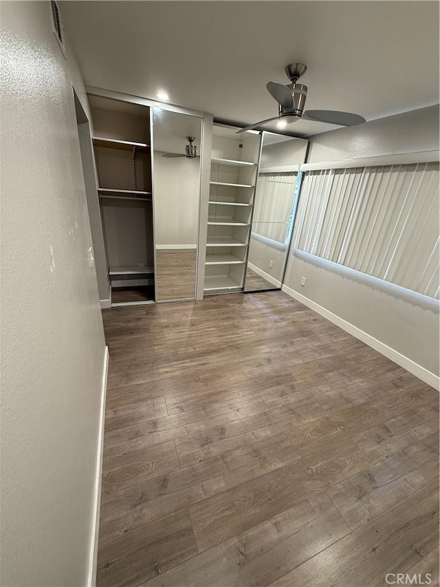 1236 N Columbus Ave Unit 28, Glendale, CA 91202 - unfurnished bedroom featuring wood finished floors and baseboards