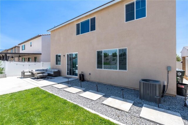 554 Cumberland Rd, Rialto, CA 92377 - back of property featuring outdoor lounge area, a patio area, and stucco siding