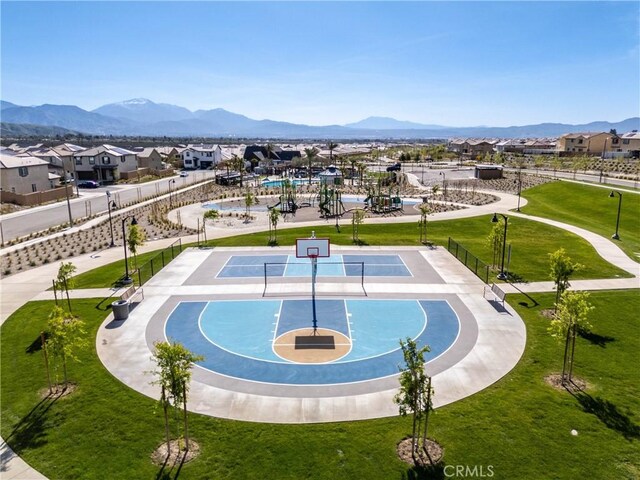 554 Cumberland Rd, Rialto, CA 92377 - view of home's community with community basketball court, a mountain view, a yard, and a residential view