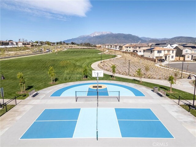 554 Cumberland Rd, Rialto, CA 92377 - view of pool featuring a mountain view, a tennis court, and a residential view