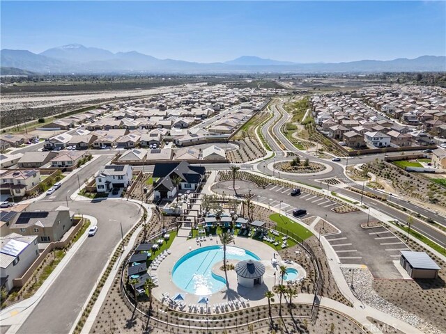 554 Cumberland Rd, Rialto, CA 92377 - aerial perspective of suburban area with a mountain backdrop and a pool area