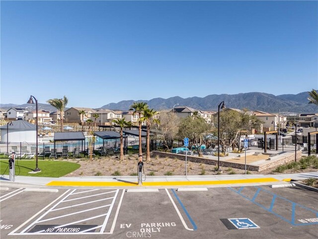 554 Cumberland Rd, Rialto, CA 92377 - uncovered parking lot featuring a mountain view and a residential view