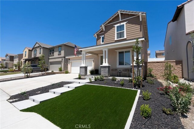 554 Cumberland Rd, Rialto, CA 92377 - craftsman inspired home with covered porch, concrete driveway, a residential view, stucco siding, and a front lawn