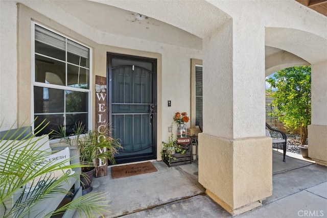 23317 Badger Creek Ln, Menifee, CA 92587 - doorway to property with stucco siding