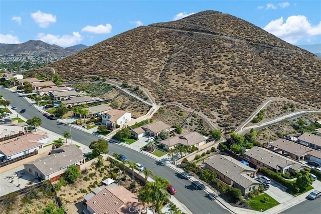 23317 Badger Creek Ln, Menifee, CA 92587 - aerial overview of property's location with a mountain backdrop and nearby suburban area