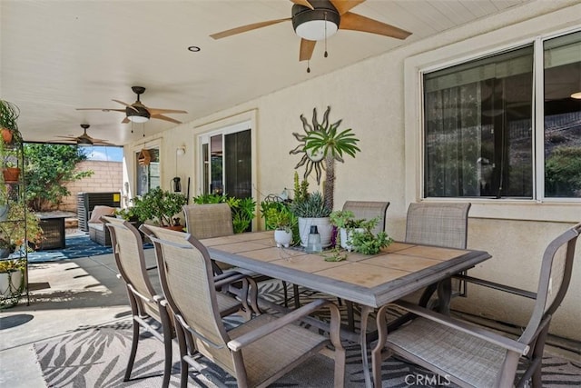 23317 Badger Creek Ln, Menifee, CA 92587 - view of patio featuring ceiling fan and outdoor dining space
