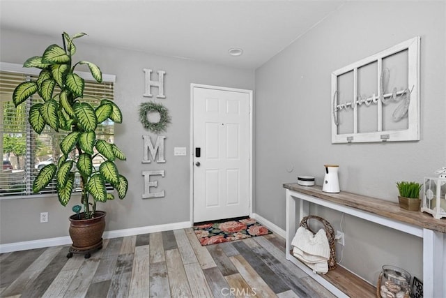 23317 Badger Creek Ln, Menifee, CA 92587 - entrance foyer featuring wood finished floors and baseboards
