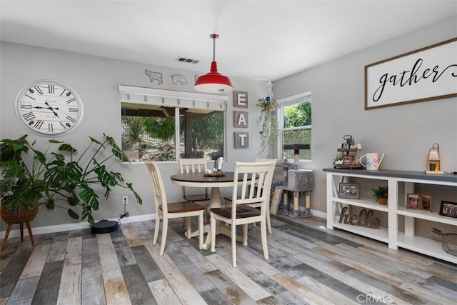 23317 Badger Creek Ln, Menifee, CA 92587 - dining area with wood finished floors and baseboards