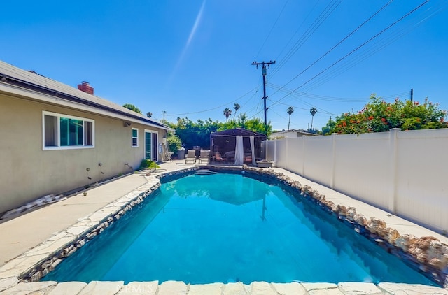 8192 Ashgrove Dr, La Mirada, CA 90638 - view of swimming pool with a gazebo, a fenced backyard, and a patio area