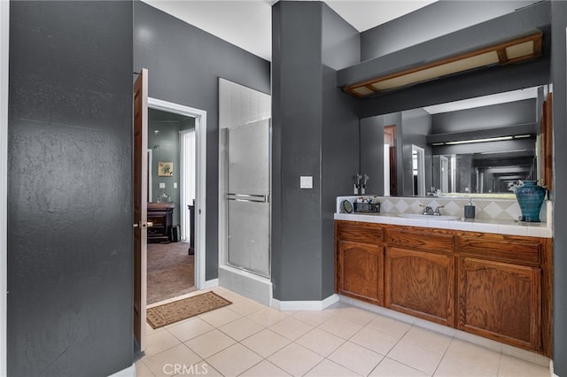 2802 Silver Shore Ln, Bakersfield, CA 93313 - bathroom featuring a shower stall, tasteful backsplash, vanity, and tile patterned floors