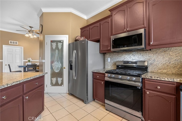 2802 Silver Shore Ln, Bakersfield, CA 93313 - kitchen featuring appliances with stainless steel finishes, crown molding, backsplash, a ceiling fan, and light tile patterned flooring