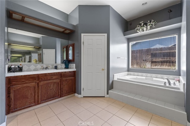 2802 Silver Shore Ln, Bakersfield, CA 93313 - bathroom with a bath, vanity, tile patterned flooring, and decorative backsplash