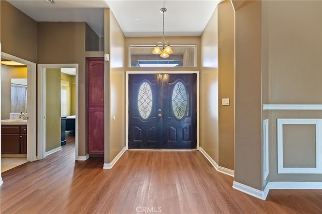 2802 Silver Shore Ln, Bakersfield, CA 93313 - entryway with wood finished floors and a chandelier