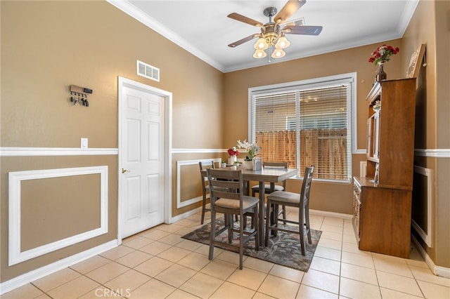 2802 Silver Shore Ln, Bakersfield, CA 93313 - dining room featuring light tile patterned floors, ceiling fan, and ornamental molding