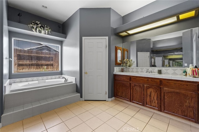2802 Silver Shore Ln, Bakersfield, CA 93313 - full bathroom featuring vanity, a garden tub, tile patterned floors, and tasteful backsplash