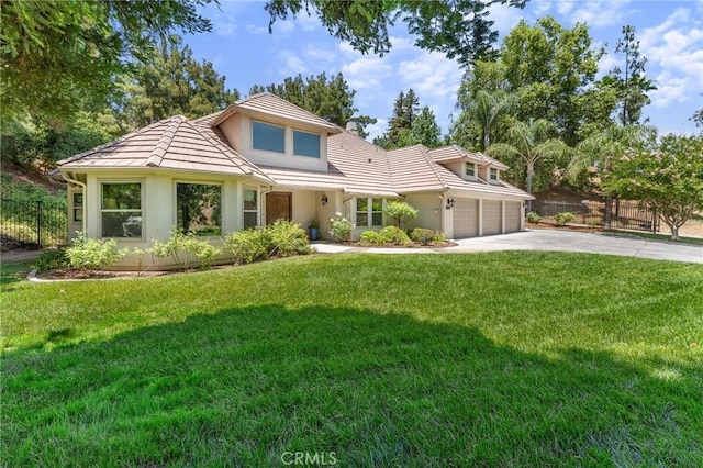 1624 Alessandro Rd, Redlands, CA 92373 - view of front of house with stucco siding, driveway, and an attached garage