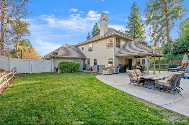 1624 Alessandro Rd, Redlands, CA 92373 - rear view of house with a gate, a fenced backyard, stucco siding, a ceiling fan, and a patio