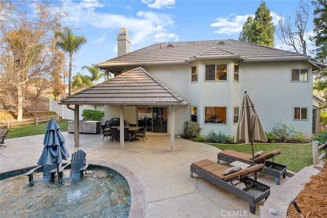 1624 Alessandro Rd, Redlands, CA 92373 - back of property with a chimney, stucco siding, a patio area, and a tile roof