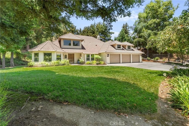 1624 Alessandro Rd, Redlands, CA 92373 - view of front of home featuring concrete driveway, stucco siding, an attached garage, and a tile roof