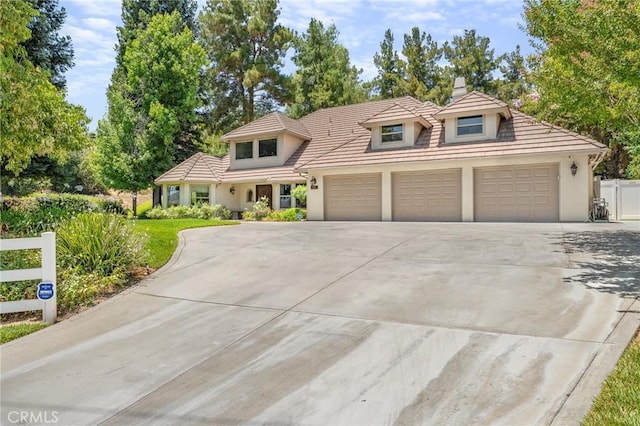 1624 Alessandro Rd, Redlands, CA 92373 - view of front facade with driveway, stucco siding, and an attached garage