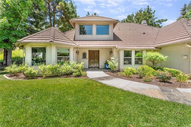 1624 Alessandro Rd, Redlands, CA 92373 - view of front of house with stucco siding, a front lawn, and a tiled roof