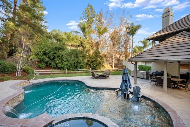 1624 Alessandro Rd, Redlands, CA 92373 - view of swimming pool featuring a fenced backyard, a patio area, outdoor dining area, a pool with connected hot tub, and view of wooded area