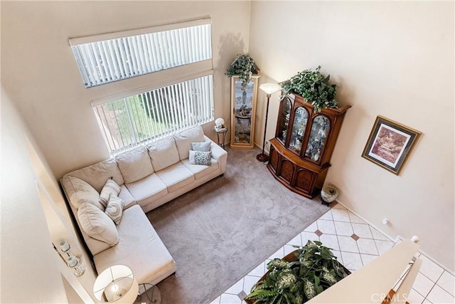 861 Shade Tree Way, Corona, CA 92878 - carpeted living area with tile patterned flooring and a high ceiling