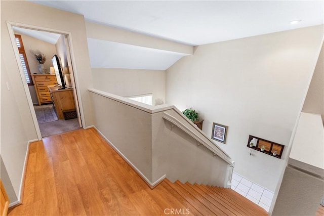 861 Shade Tree Way, Corona, CA 92878 - hallway with an upstairs landing, vaulted ceiling, and wood finished floors