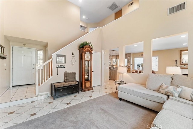 861 Shade Tree Way, Corona, CA 92878 - living room featuring tile patterned flooring, stairs, a towering ceiling, and recessed lighting
