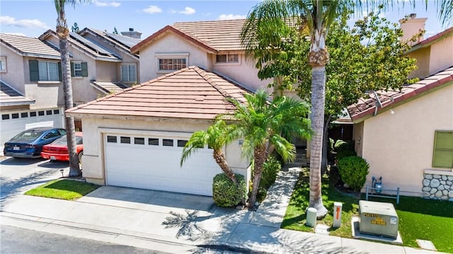 861 Shade Tree Way, Corona, CA 92878 - view of front of home featuring a tiled roof, driveway, stucco siding, and an attached garage